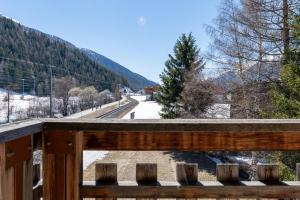 a view of a train station from a wooden bridge at Ferienwohnung Loipenblick in Obergesteln