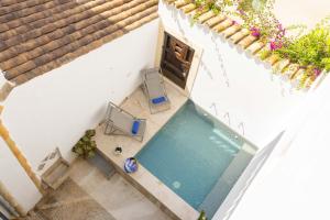 an overhead view of a swimming pool in a building at Casa Angels in Pollença