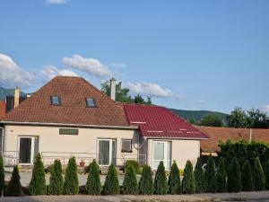 a white house with a red roof at Ubytovanie Čereňany in Čereňany