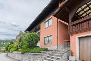 a brick house with a staircase in front of it at Ferienhaus Fanny in Lam