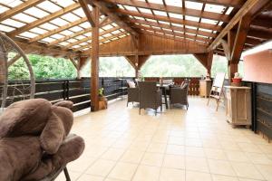a teddy bear sitting on a chair in a pavilion at Ferienhaus Fanny in Lam