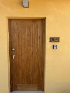 a wooden door in the corner of a room at Quinta-lina de serpins in Serpins +115 photos