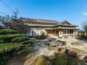 a house with a garden in front of it at keganiya 一棟貸し北九州空港近くの和風宿 in Yukuhashi +49 photos