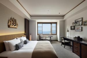เตียงในห้องที่ The ORIENT +75 ภาพ