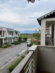 a view from the balcony of a house with a street at Paradise Villa in Siliguri