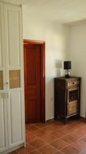 an empty room with a door and a table with a lamp at Beach Villa Pasithea in Neokhórion