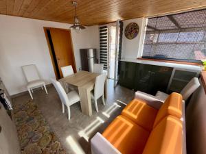 a living room with a table and a couch at La Pergola B&B in Custonaci