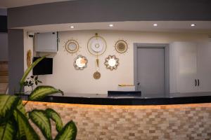 a room with a counter with decorations on the wall at Nora Suit Hotel in Side +78 photos