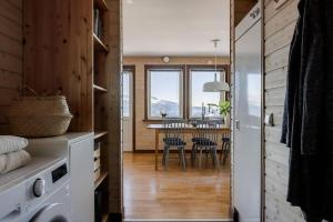 a kitchen and dining room with a table and chairs at Dream view in Åre Björnen in Åre