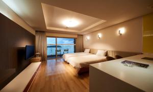 a hotel room with a bed and a balcony at Eldorado Resort in Sinan +40 photos