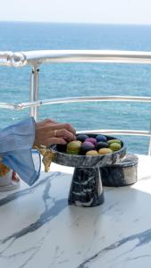 a person holding a bowl of eggs on a boat at Er Suite in Alanya