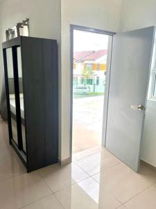 an open door in a room with a door at Caro Home in Malacca