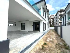an external view of a white house with a courtyard at Caro Home in Malacca