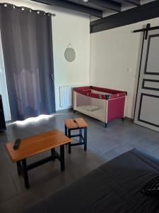 a living room with a couch and a table at Gite du Canal in Gannay-sur-Loire