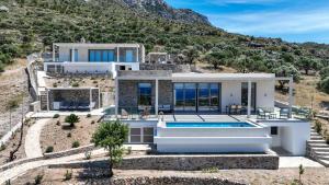 an aerial view of a villa with a swimming pool at Villa Elliopetra - Adults Only in Vasilikí