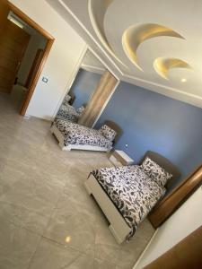 an image of a room with two beds at kelibia in Kelibia