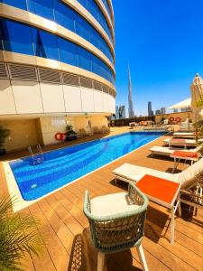 a swimming pool on the roof of a building at Carlton Downtown Hotel in Dubai