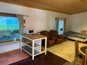 a living room with a couch and a table at Very Attractive Location in Täby