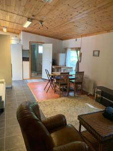 a living room with a couch and a table at Very Attractive Location in Täby