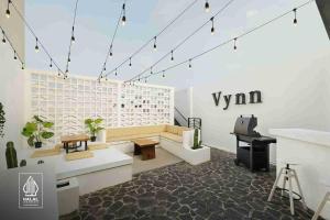 a living room with a couch and a table at Swiss-Belexpress Cilegon in Cilegon