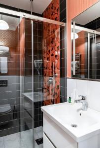 a bathroom with a sink and a shower at West inn Luxury Baku in Baku +22 photos