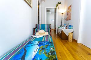 a hat sitting on a couch in a room at Ánemos b&b in Termoli