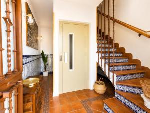 a hallway with a staircase in a house at CasaConchaGuadamur in Guadamur