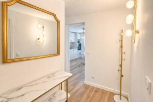 a bathroom with a mirror on the wall at L'Esterel Appartements Plage 450m & Gare Saint-Raphael 950m in Fréjus +111 photos
