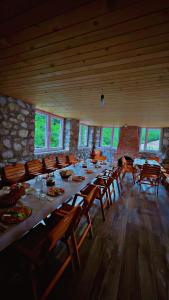 a large dining room with a long table and chairs at Rosi peak Guesthouse in Valbonë +68 photos