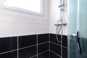a bathroom with a shower with a window at L'interlude in Amélie-les-Bains-Palalda +15 photos