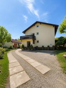 a house with a walkway in front of it at Apartma Tanja bike-friendly in Limbuš