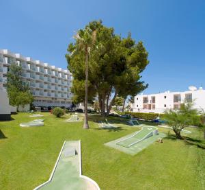 a park with a playground with slides and a building at Hotel Vibra Riviera in San Antonio Bay +47 photos