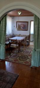 a living room with a table and a couch at Bungalow Au in Illertissen