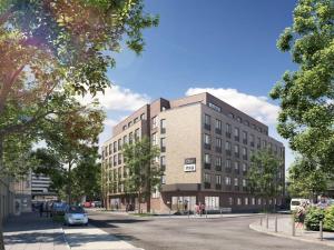 a rendering of a building on a city street at the niu Clink in Hamburg