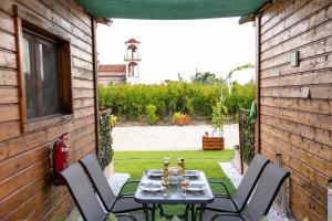 a table and chairs sitting on a patio at Kandia Woodlands in Kandia +51 photos