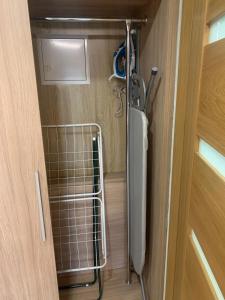 a bathroom with a towel rack next to a door at Pod Grzybkiem in Zawady +36 photos