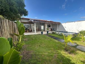 a view of a house with a yard at Casa Rio - Santo Amaro in Santo Amaro