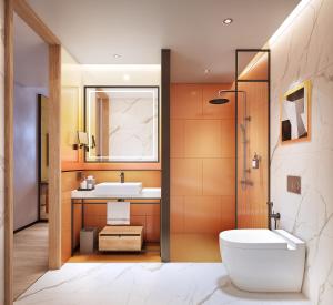 a bathroom with a toilet and a sink at Ibis Bangkok Siam Ratchathewi in Bangkok