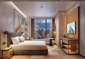a bedroom with a bed and a desk with a window at Ibis Bangkok Siam Ratchathewi in Bangkok