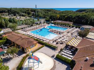 an aerial view of a resort with a swimming pool at Club del Sole Le Gorette Cecina Easy Camping Village in Marina di Cecina