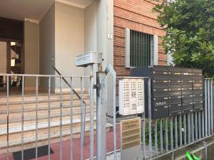 a metal fence in front of a building at Casa dei Navigatori in Verona