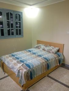 a bedroom with a bed in a room at Saïda Friends in Zemmour Touirza