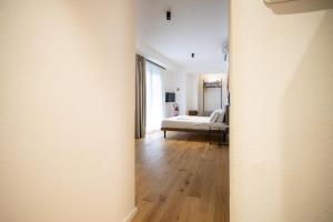 an open doorway to a bedroom with a bed at Solemar Sicilia - Torre Maqueda in Palermo