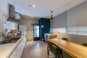 a kitchen with a sink and a counter top at NU Hotel in Cheonan