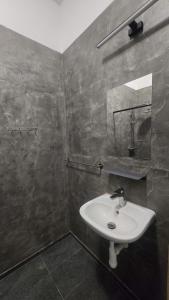 a bathroom with a sink and a mirror at Ubytovna Chropyně in Kroměříž