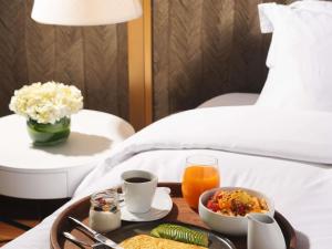 a tray of food on a table in a hotel room at Manto Hotel Lima - MGallery Collection in Lima