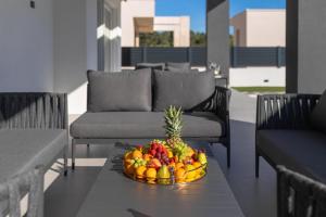 a bowl of fruit on a table on a patio at Villa della Rode in Lozovac