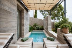 a swimming pool in the backyard of a house at ROSEMARY hôtel in Bastia