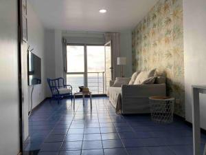 a living room with a couch and a table at Numancia 1 - 2A in Las Palmas de Gran Canaria +41 photos