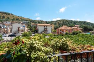 a view of a small town from a balcony at Parmenide Family Apartment in Ascea